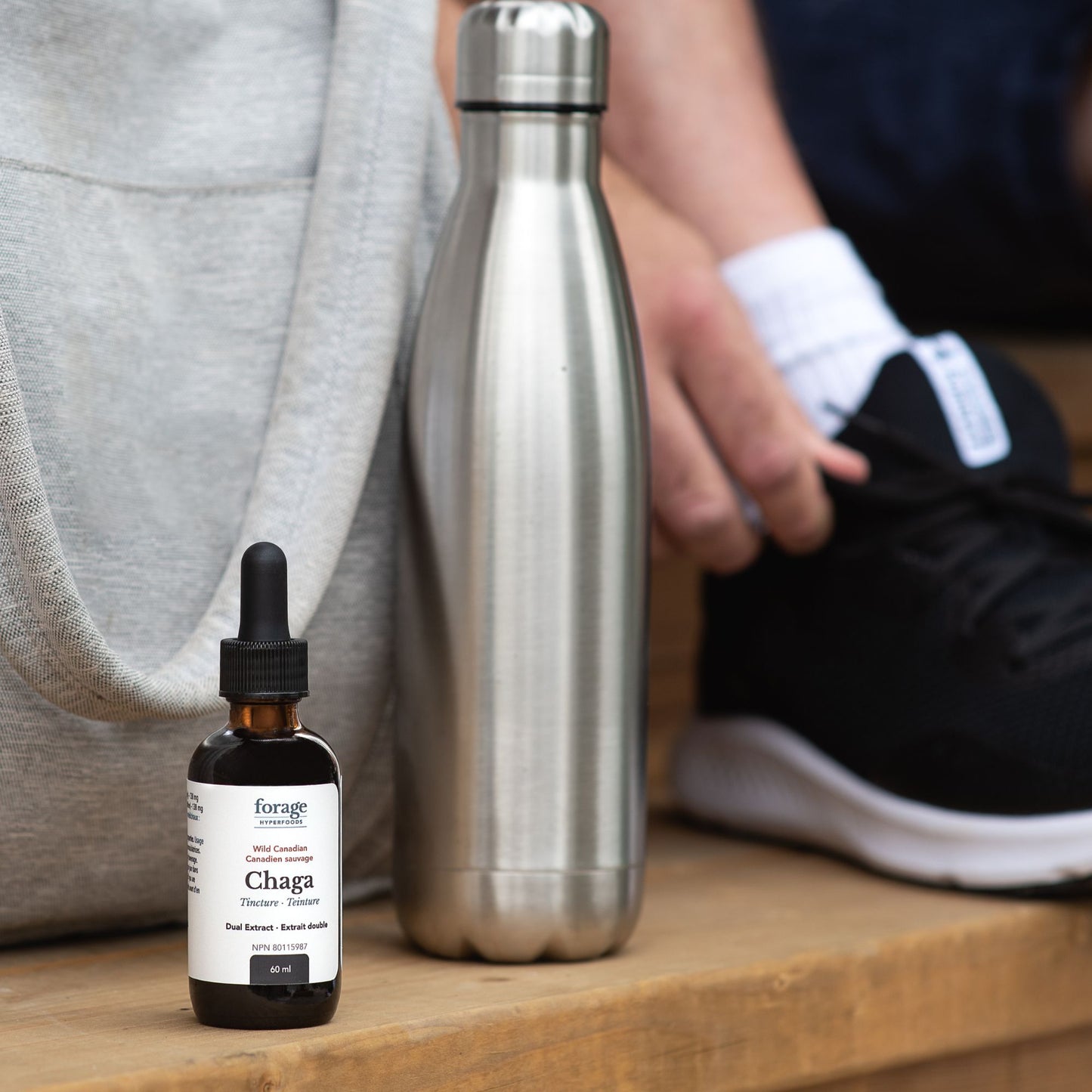 60 mL Chaga tincture in Original format outside as somebody goes to a gym.