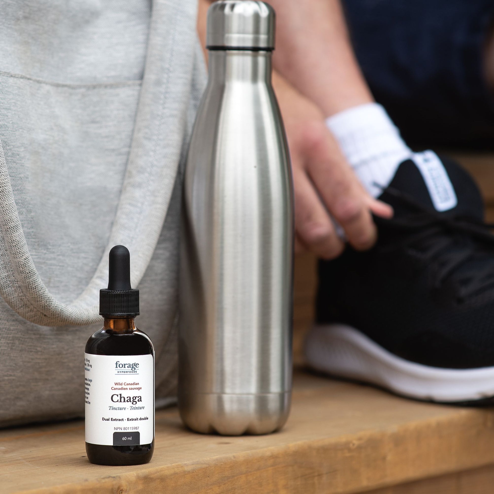 60 mL Chaga tincture in Original format outside as somebody goes to a gym.