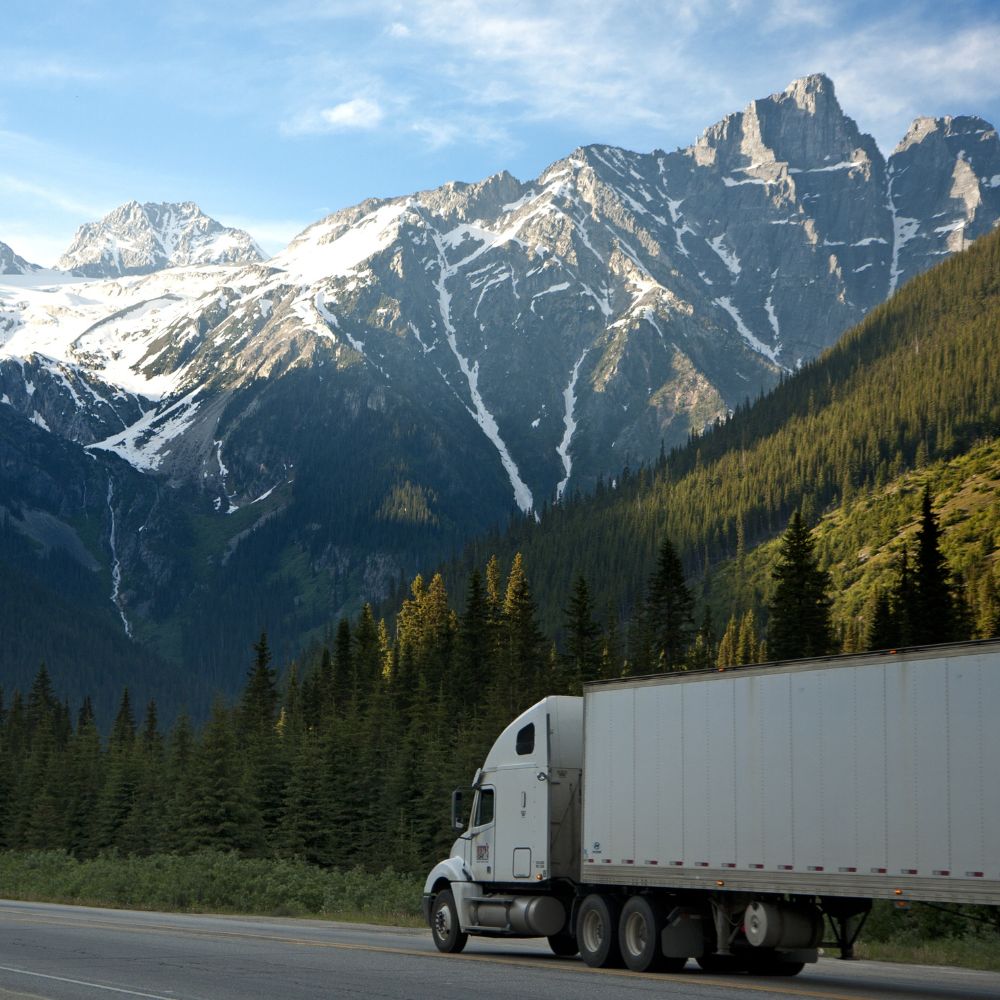 Square image of a freight truck delivering in Western Canada. 