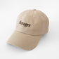 A Cream Oatmeal Coloured Dad Style Hat with Forager on the front 