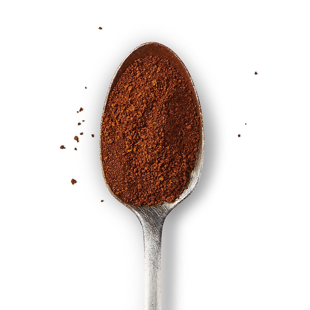 A spoon full of Chaga Powder against a white background. 