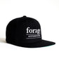 A black snapback hat with white "forage hyperfoods" embroidered on the front. It 