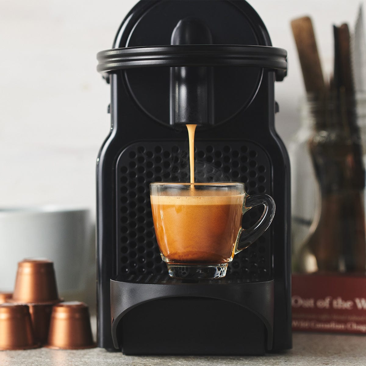 An out of the Woods Chaga-Infused Coffee in a Nespresso compatible format by Forage Hyperfoods, in a Nespresso machine.