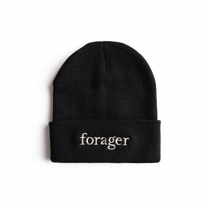 A black beanie with the word "forager" on it. 